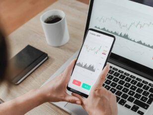 Forex trader using crypto exchange mobile phone app for investment and stock market analysis at hedge fund office - Focus on screen Neukundenregistrierung