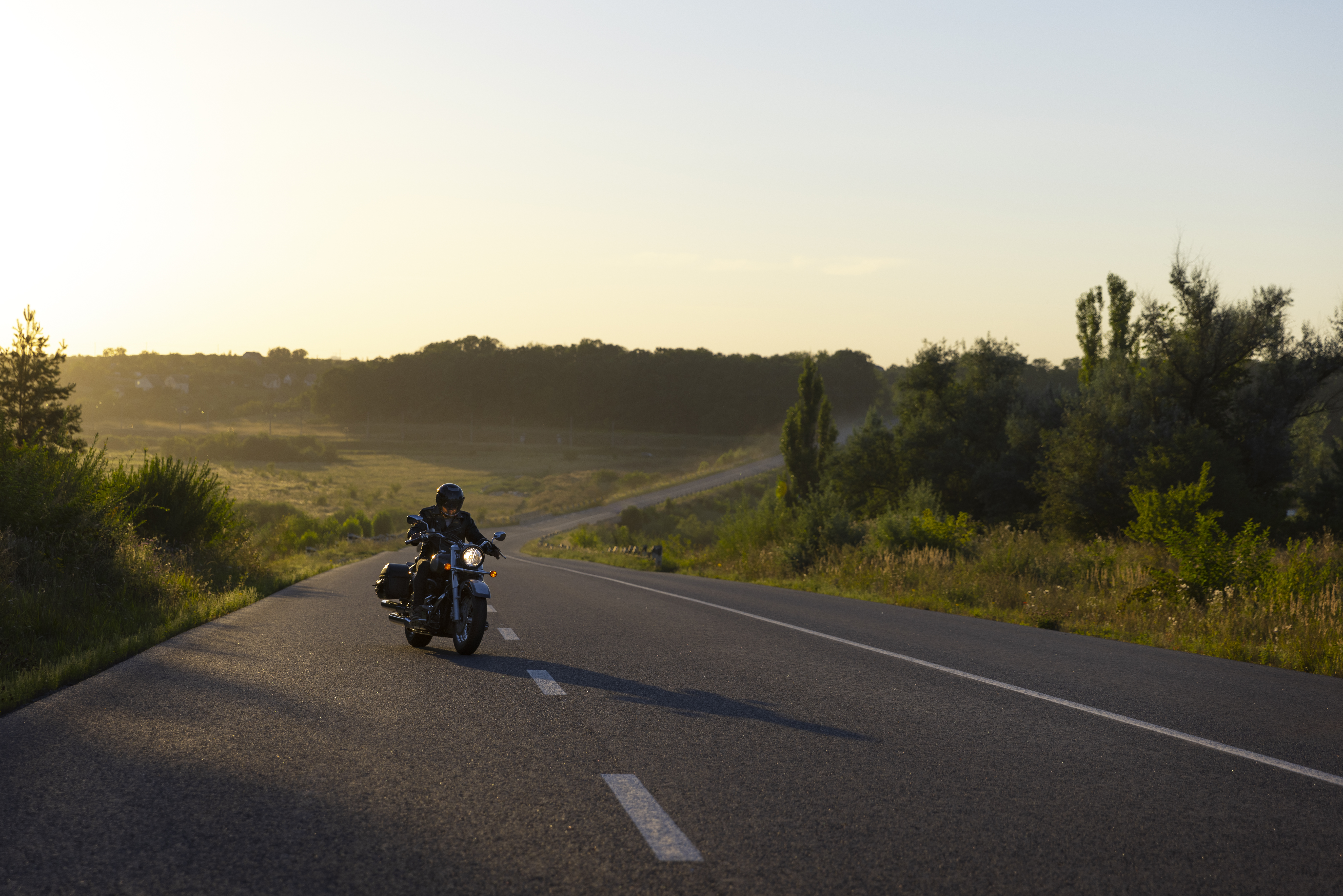 long-shot-man-riding-motorbike